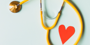 stethoscope encircling a heart to represent transparency at healthcare